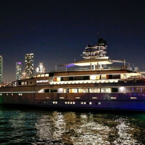 nighttime yacht docked at Island Gardens Deep Harbor