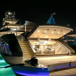 back of yacht lite up at night at Island Gardens Deep Harbor